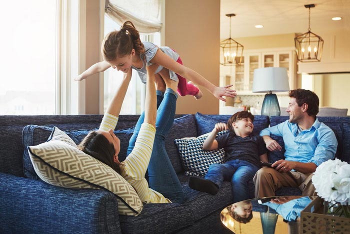 Family playing in a home set to a comfortable temperature